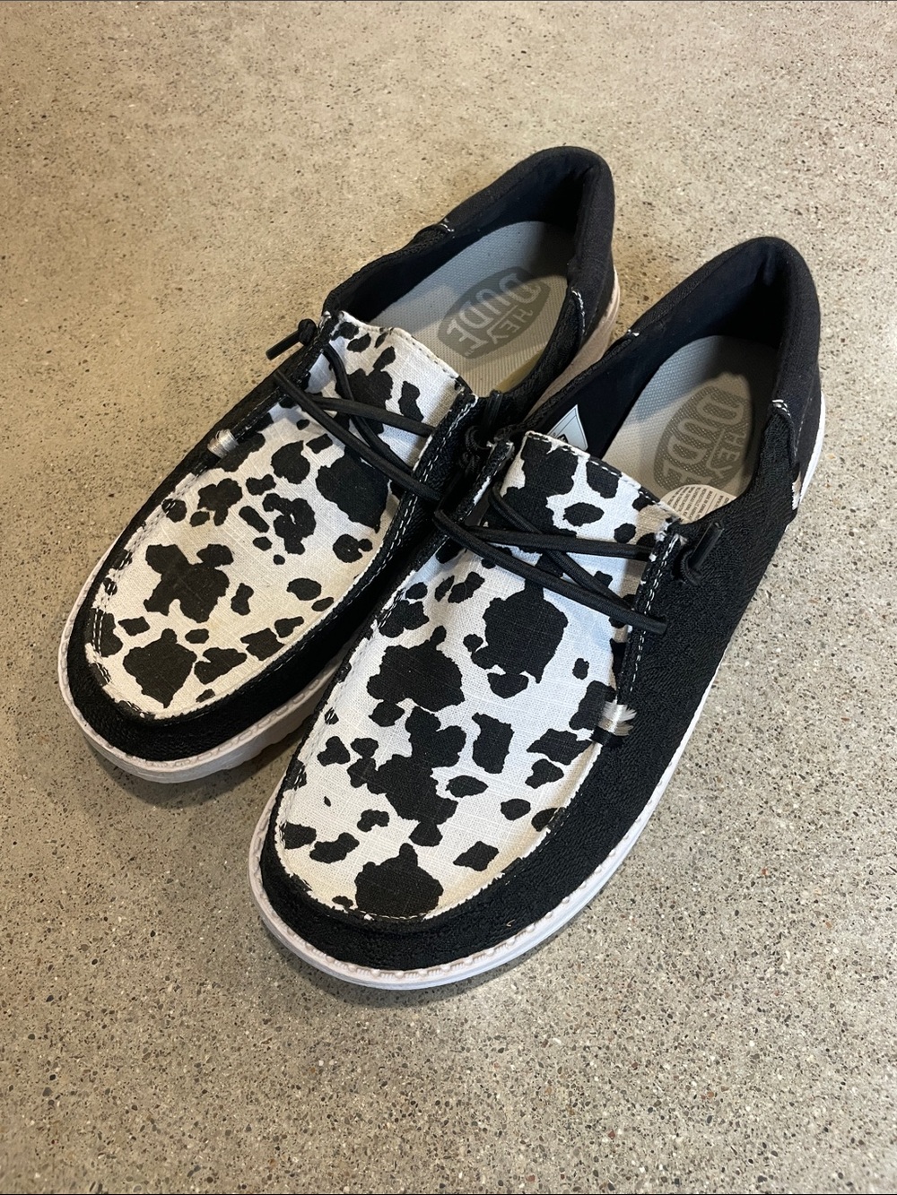Hey Dude Women’s Slip-On Loafers in Black & White Cow Print